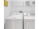 Laundry room with washer and dryer, and overhead shelving at 1407 Chatfield Pl, Orlando, FL 32814