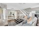 Spacious living room with hardwood floors, sectional sofa, and dining area at 1407 Chatfield Pl, Orlando, FL 32814