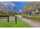 Entrance to Blue Jacket Park with walking paths and benches at 1407 Chatfield Pl, Orlando, FL 32814