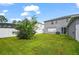 Fenced backyard with grassy lawn at 14236 Golden Rain Tree Blvd, Orlando, FL 32828