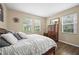 Bright bedroom with wood floors and a large window providing natural light at 14236 Golden Rain Tree Blvd, Orlando, FL 32828