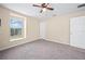 Bright bedroom with carpeted floor and large window at 14236 Golden Rain Tree Blvd, Orlando, FL 32828