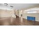 Spacious dining room with wood-look floors and a view into the kitchen at 14236 Golden Rain Tree Blvd, Orlando, FL 32828