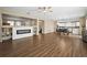 Open living and dining area with hardwood floors and a modern fireplace at 14236 Golden Rain Tree Blvd, Orlando, FL 32828