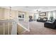 Spacious loft area with plush seating and a large screen TV at 14236 Golden Rain Tree Blvd, Orlando, FL 32828