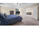 Main bedroom with large TV, sitting area and access to bathroom at 14236 Golden Rain Tree Blvd, Orlando, FL 32828