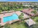 Community pool and clubhouse with shade structures at 14639 Crosston Bay Ct, Orlando, FL 32824