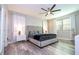 Elegant bedroom with a king-size bed and gray color scheme at 14746 Scott Key Dr, Winter Garden, FL 34787