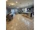 Open kitchen with island, granite countertops, and stainless steel appliances at 1662 Lima Ave, Kissimmee, FL 34747