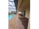 Screened-in pool area with lounge chairs and patio furniture at 1662 Lima Ave, Kissimmee, FL 34747