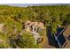 Aerial view of the luxury home showcasing its sprawling layout, mature trees and circular driveway at 16902 Vinci Way, Montverde, FL 34756