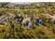 Aerial view of the large luxury home with a dark roof and multiple connected sections at 16902 Vinci Way, Montverde, FL 34756