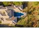 A high-angle view of a luxurious residence featuring a private pool and meticulously maintained backyard at 16902 Vinci Way, Montverde, FL 34756