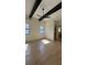 Bright bedroom featuring hardwood floors, ceiling beams, and access to a well-appointed ensuite bathroom at 16902 Vinci Way, Montverde, FL 34756
