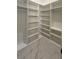 Spacious walk-in closet with custom shelving and ample storage, providing organized luxury at 16902 Vinci Way, Montverde, FL 34756
