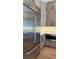 Modern kitchen features stainless steel appliances, stylish cabinets, and a tiled backsplash at 16902 Vinci Way, Montverde, FL 34756