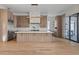 Beautiful open kitchen boasts custom wood cabinets, a marble backsplash, and a large center island at 16902 Vinci Way, Montverde, FL 34756