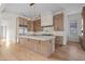 Modern kitchen features a large island, custom cabinetry, and high-end stainless steel appliances at 16902 Vinci Way, Montverde, FL 34756