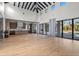 Spacious open-concept living area with modern kitchen, fireplace, and sliding glass doors to the pool at 16902 Vinci Way, Montverde, FL 34756