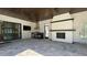 Outdoor kitchen featuring a fireplace, built-in grill, and sliding doors to the interior at 16902 Vinci Way, Montverde, FL 34756