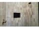 Modern shower showcasing unique vertical tiles and a niche for storage, blending style and functionality at 16902 Vinci Way, Montverde, FL 34756