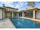 Backyard swimming pool with an attached spa, surrounded by a patio and luxurious outdoor space at 16902 Vinci Way, Montverde, FL 34756