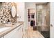 Bathroom with double vanity, walk-in closet, and shower at 1809 Hawksbill Ln, St Cloud, FL 34771