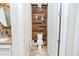 Small powder room with wood-look feature wall and modern toilet at 1809 Hawksbill Ln, St Cloud, FL 34771