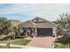 One-story home with green garage door and landscaped yard at 1809 Hawksbill Ln, St Cloud, FL 34771