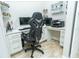 Home office with a large desk and comfortable office chair at 1809 Hawksbill Ln, St Cloud, FL 34771