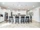 Island kitchen with white cabinets and seating for six at 1809 Hawksbill Ln, St Cloud, FL 34771