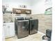 Laundry room with washer, dryer, and utility sink at 1809 Hawksbill Ln, St Cloud, FL 34771