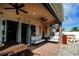 Covered patio with seating area and ceiling fan at 1809 Hawksbill Ln, St Cloud, FL 34771