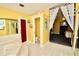Bathroom with jacuzzi tub, toilet, and access to bedroom at 1947 Quintilis Ct, Deltona, FL 32738