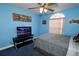 Bedroom featuring a TV, double bed, and ceiling fan at 1947 Quintilis Ct, Deltona, FL 32738
