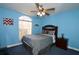 Bright bedroom with double bed, ceiling fan, and window at 1947 Quintilis Ct, Deltona, FL 32738
