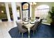 Bright dining room with seating for six and a chandelier at 1947 Quintilis Ct, Deltona, FL 32738