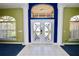 Spacious entryway with double doors and tile flooring at 1947 Quintilis Ct, Deltona, FL 32738