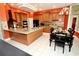 Spacious kitchen with island, wood cabinets, and breakfast nook at 1947 Quintilis Ct, Deltona, FL 32738