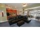 Open floor plan with leather sectional and view of lake at 1947 Quintilis Ct, Deltona, FL 32738