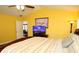 Main bedroom with king-size bed, TV, and access to bathroom at 1947 Quintilis Ct, Deltona, FL 32738