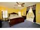 Spacious main bedroom with king-size bed and ensuite bathroom access at 1947 Quintilis Ct, Deltona, FL 32738