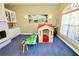 Playroom with a playhouse and two tables at 1947 Quintilis Ct, Deltona, FL 32738