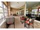 Relaxing screened porch with wicker furniture and lake views at 1947 Quintilis Ct, Deltona, FL 32738