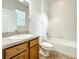 Neat bathroom with a tub, toilet, and vanity at 2125 Tybee Rd, St Cloud, FL 34769