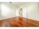 Hardwood floor bedroom with double doors leading to staircase at 2125 Tybee Rd, St Cloud, FL 34769