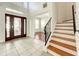 Elegant entryway with hardwood stairs and tile floors at 2125 Tybee Rd, St Cloud, FL 34769