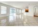 Bright and spacious living room with tile floors and sliding glass doors leading to the backyard at 2125 Tybee Rd, St Cloud, FL 34769