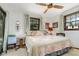 Sunlit bedroom featuring a ceiling fan and windows that let in natural light for a bright and airy feel at 2351 Mandarin Rd, Deland, FL 32720