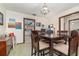 Bright dining room with classic chandelier and view into the kitchen at 2351 Mandarin Rd, Deland, FL 32720